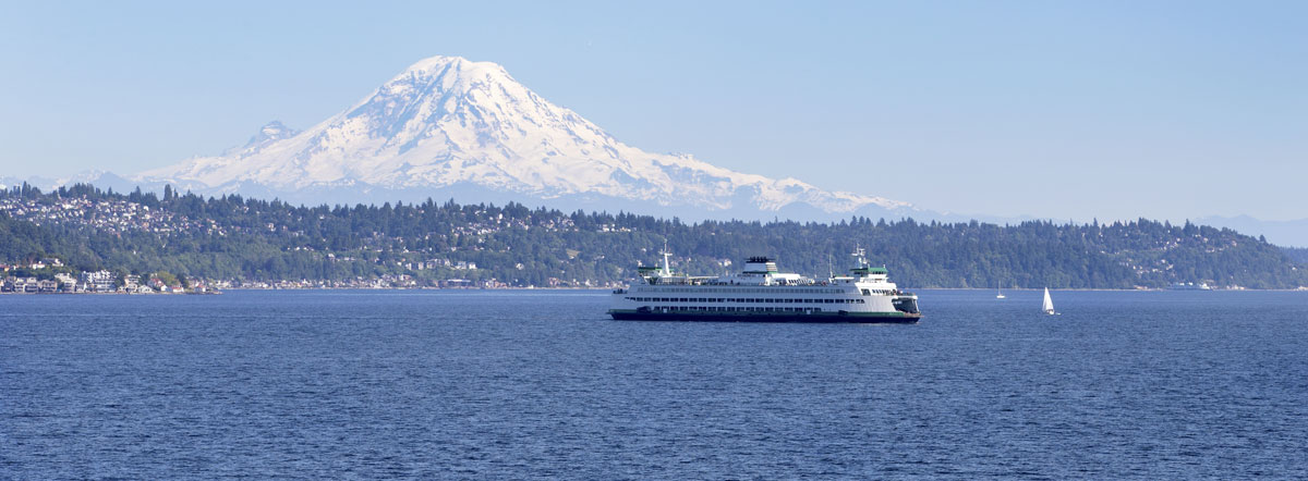 Ferry moving across Puget Sound with Mt. Rainier prominent in the background.